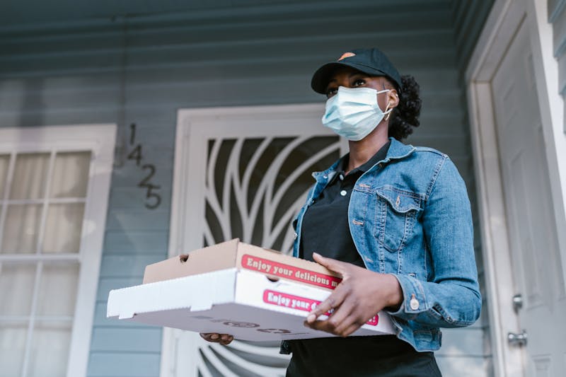 Apache Pizza delivery driver bringing fresh pizza to Dublin customer