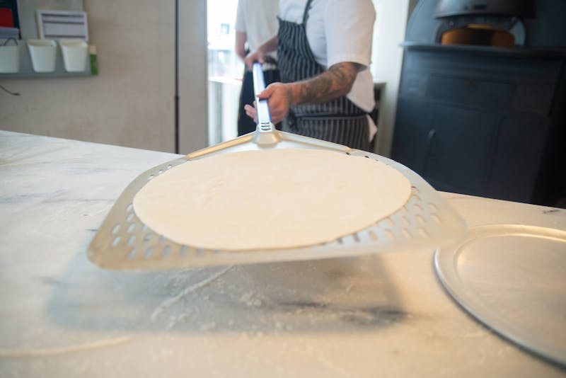 Pizza chef preparing fresh dough